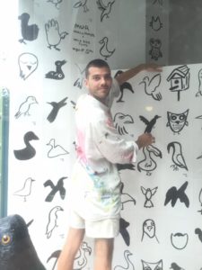 Mur Installing his artwork at the Wild Bird Fund